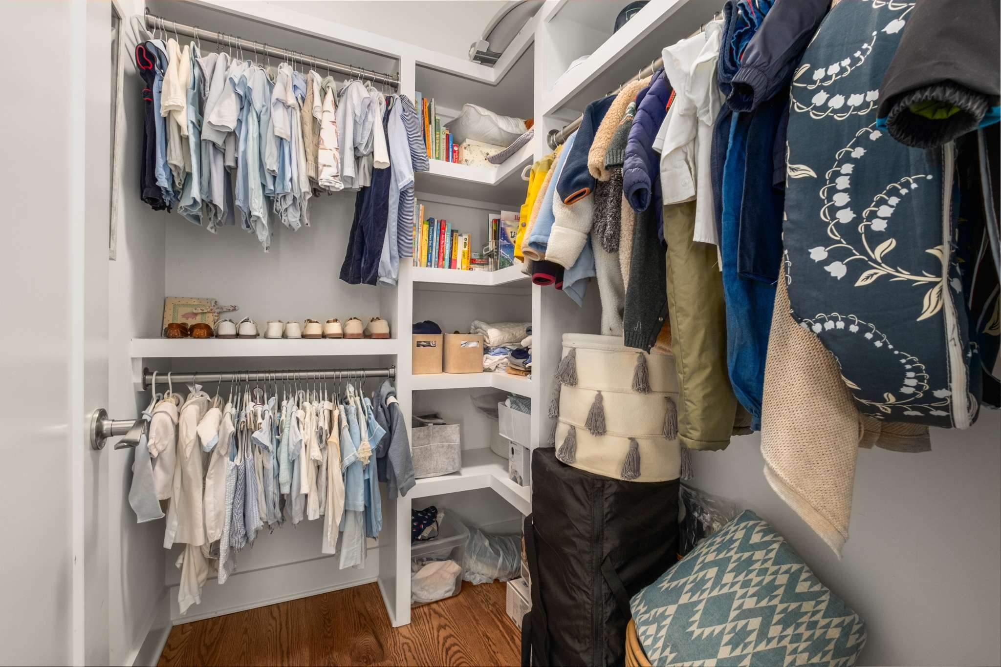 115 Rains Avenue, Unit A Nashville, TN 37203 - Photo 35 of 46 a view of walk in closet with clothes and shoes