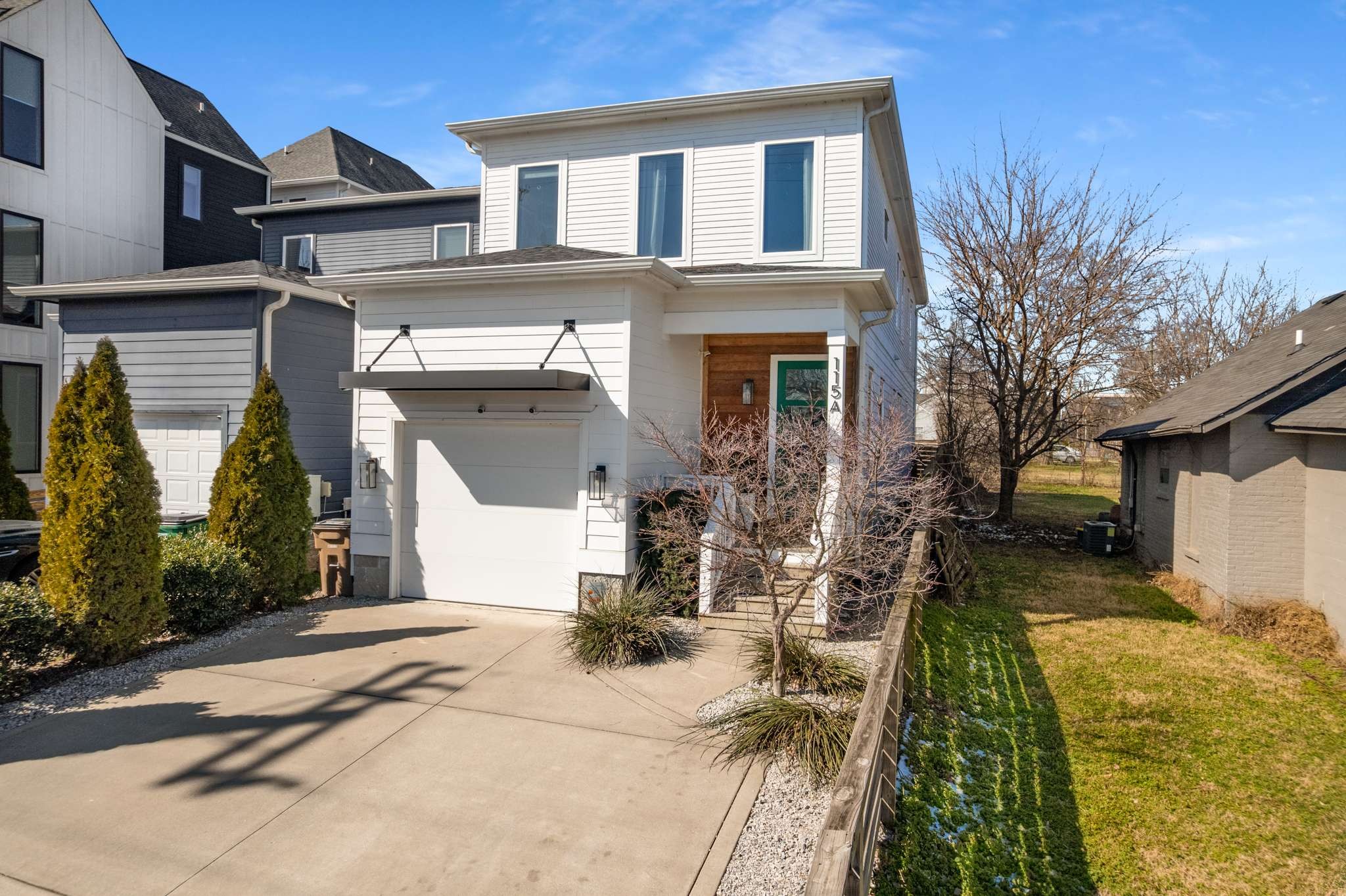 115 Rains Avenue, Unit A Nashville, TN 37203 - Photo 4 of 46 a front view of a house with a yard