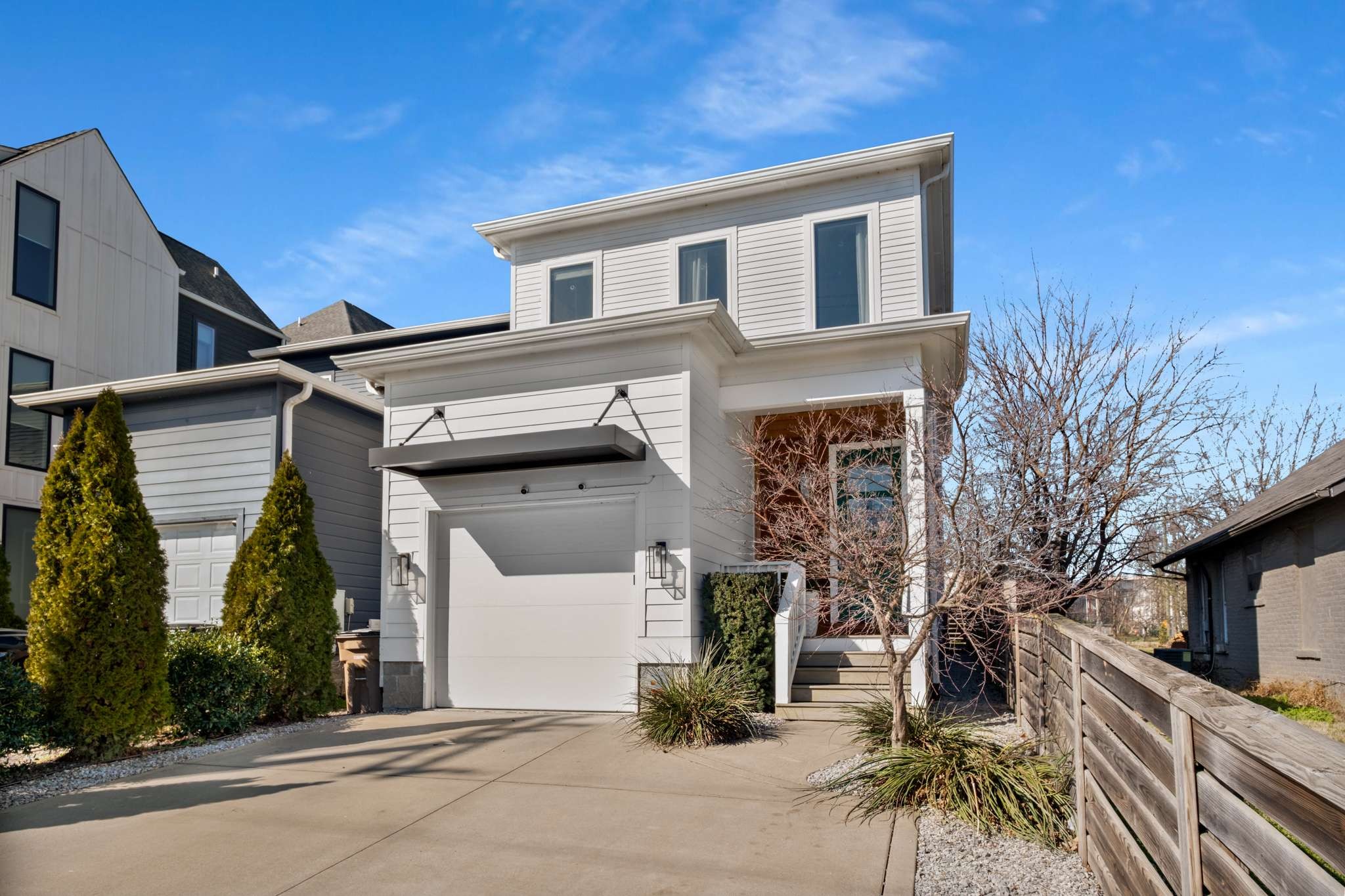115 Rains Avenue, Unit A Nashville, TN 37203 - Photo 46 of 46 a front view of a house with garage