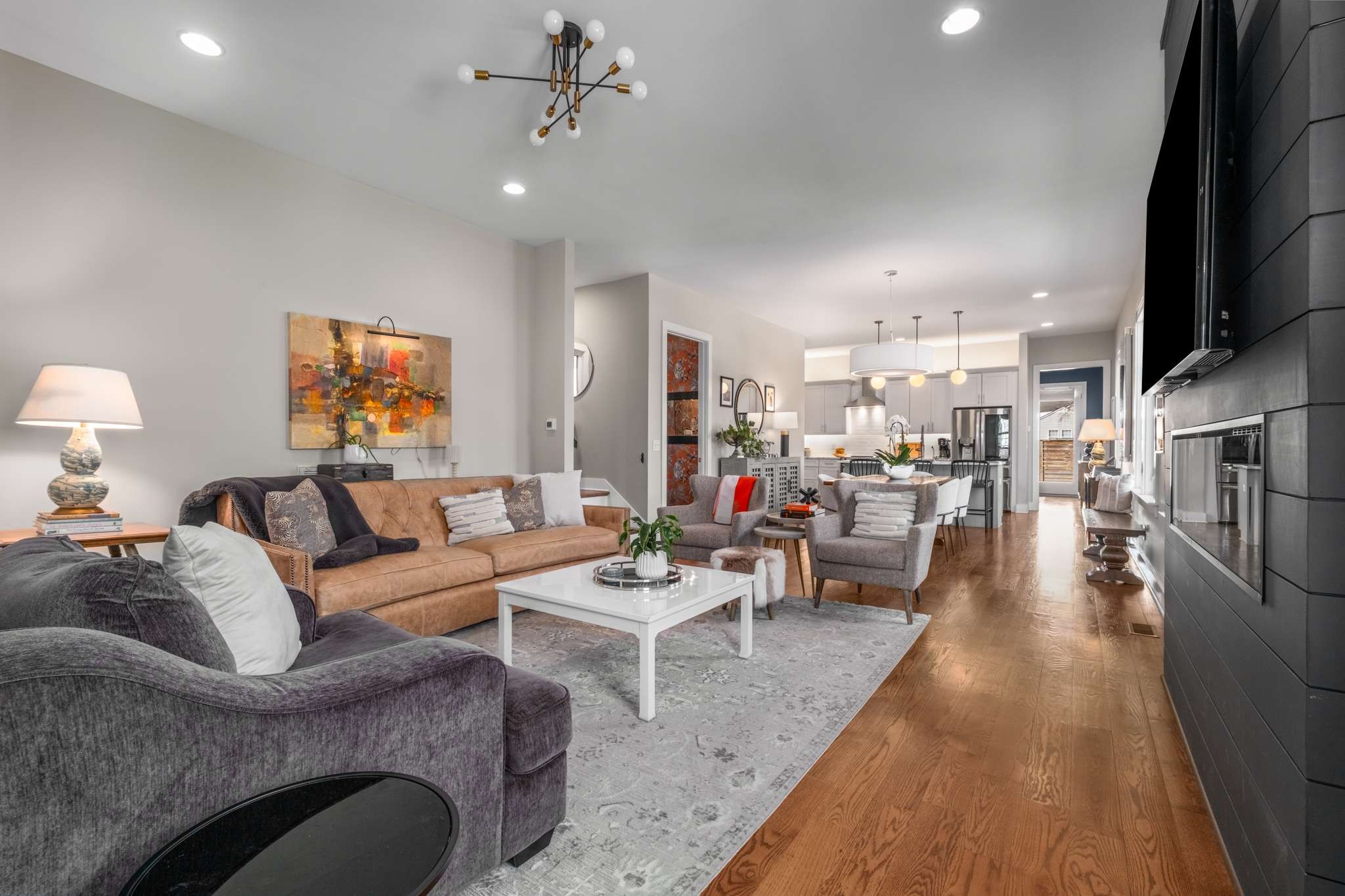 115 Rains Avenue, Unit A Nashville, TN 37203 - Photo 6 of 46 a living room with furniture and a flat screen tv