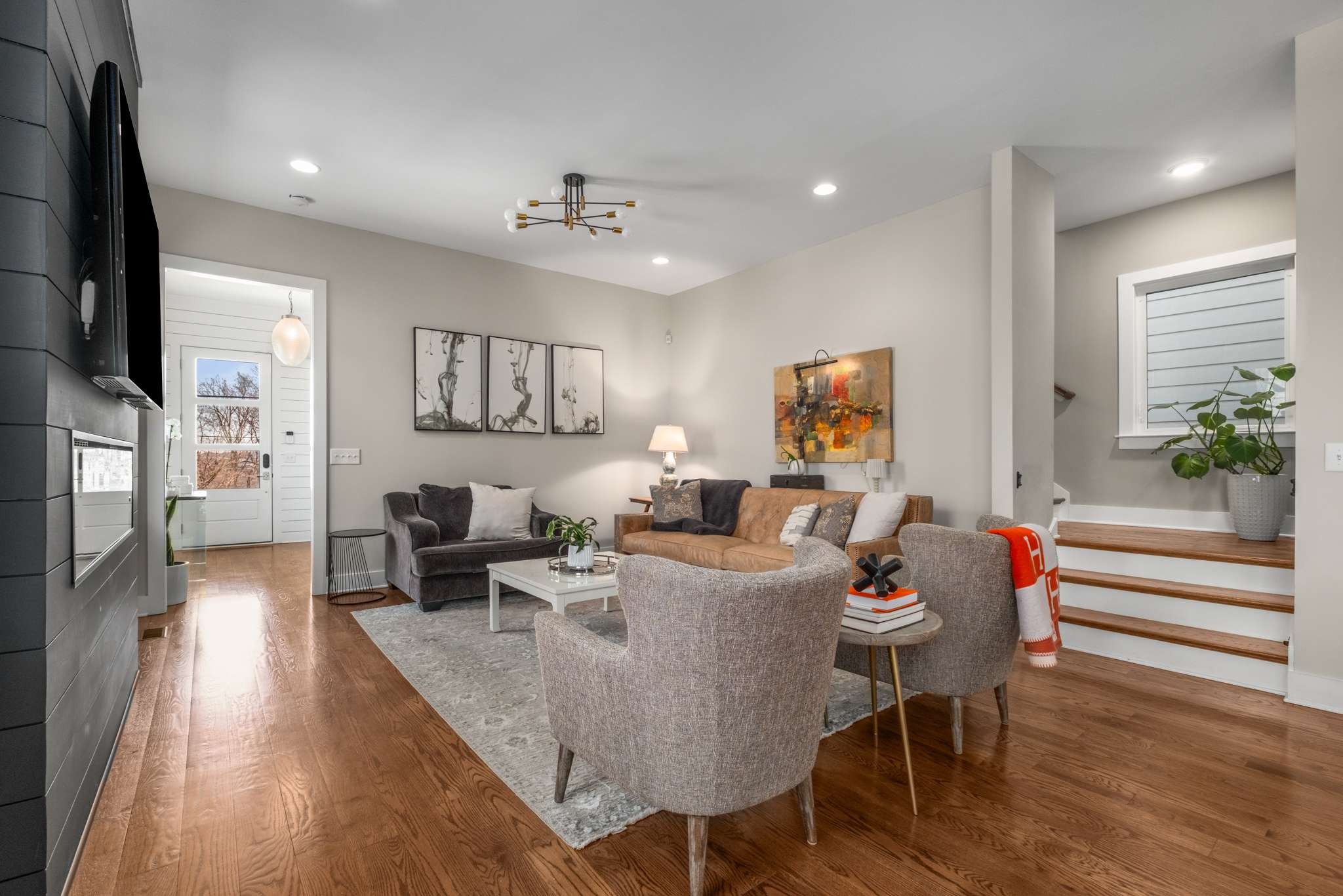 115 Rains Avenue, Unit A Nashville, TN 37203 - Photo 7 of 46 a living room with furniture and a flat screen tv