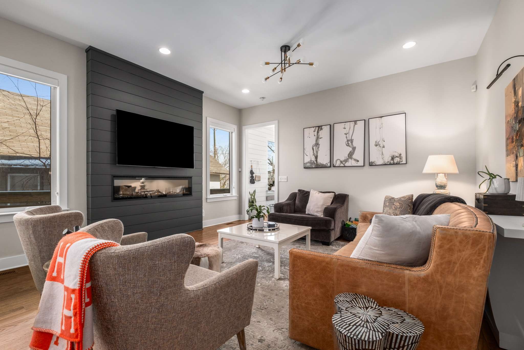 115 Rains Avenue, Unit A Nashville, TN 37203 - Photo 8 of 46 a living room with furniture and a flat screen tv