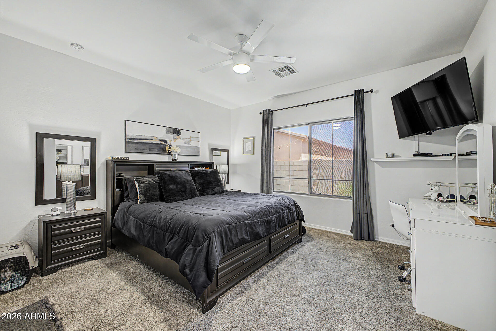 4924 West Harwell Road Laveen, AZ 85339 - Photo 15 of 27 a bed room with a bed and a television
