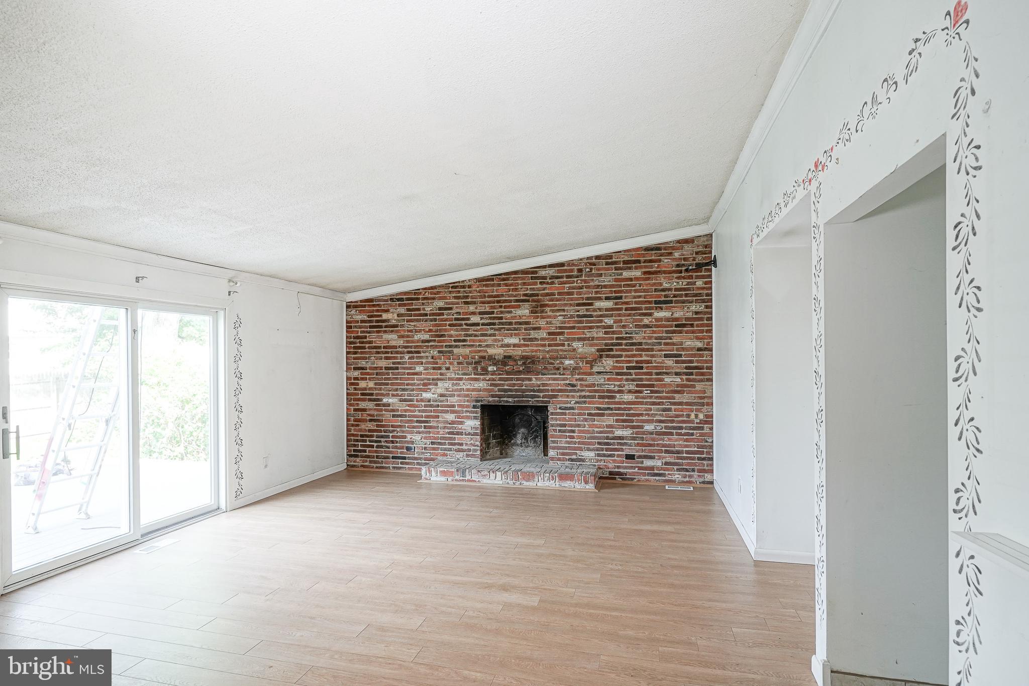 152 Kelly Driver Road Laurel Springs, NJ 08021 - Photo 13 of 30 a view of empty room with window and fireplace