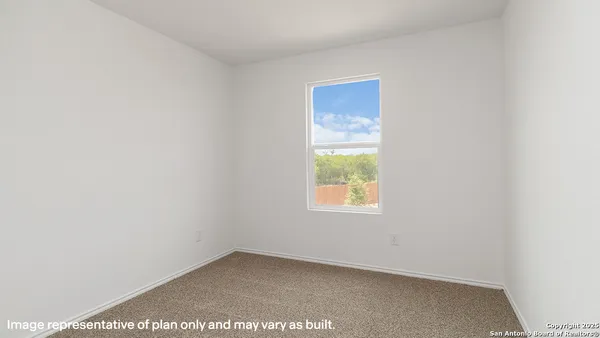 a view of a hall with an empty wall