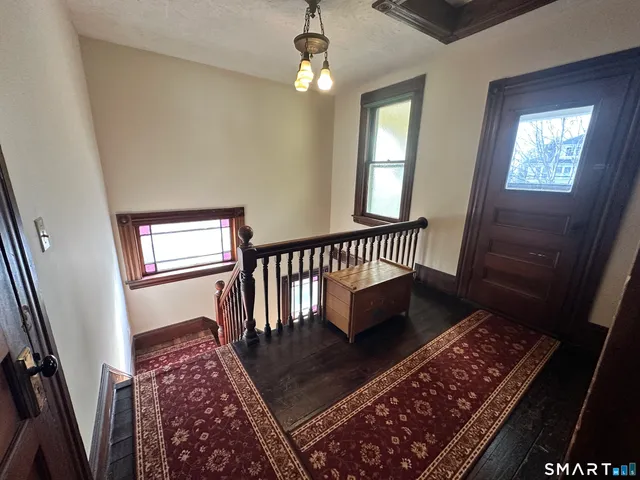 a view of entryway with wooden floor
