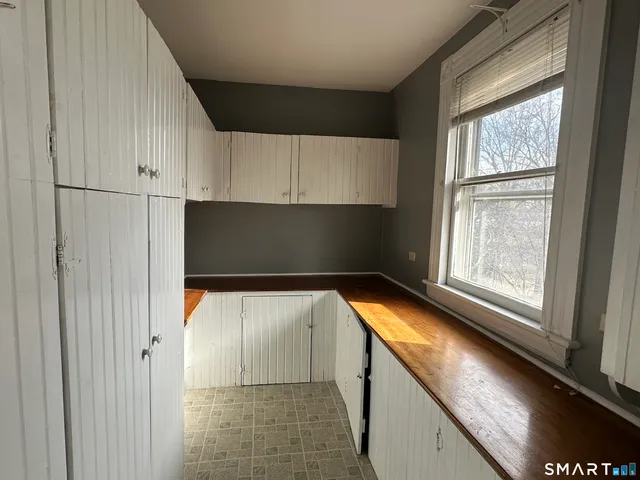 a view of walk in closet with window