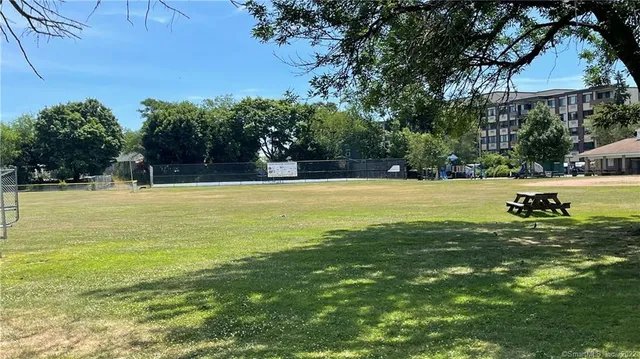 a view of a swimming pool with an outdoor space and seating area