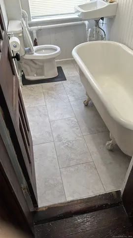 a bathroom with a sink and a toilet