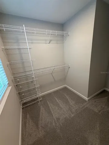 a view of a room with racks on the wall