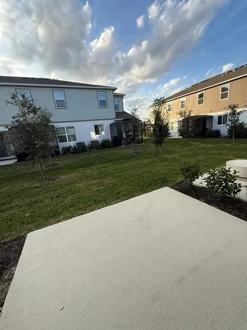 a view of a house with a back yard