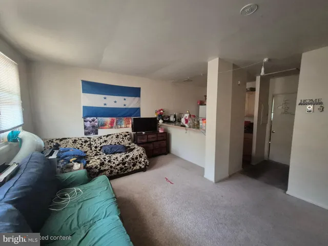 a kitchen with a sink and refrigerator