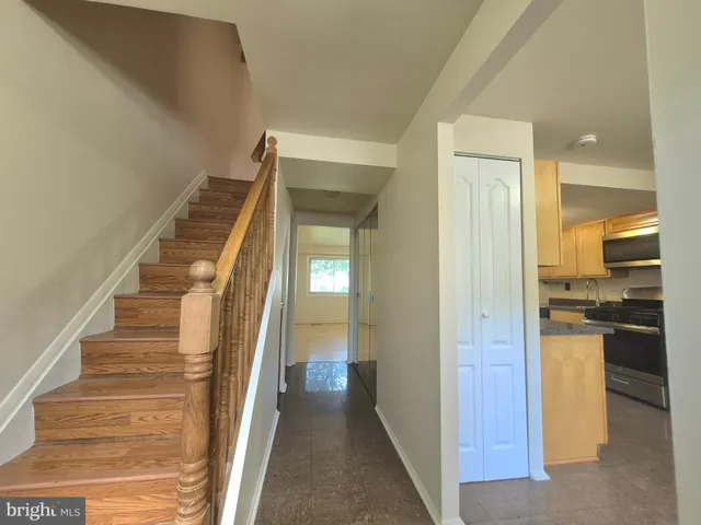 a kitchen with a refrigerator and a stove