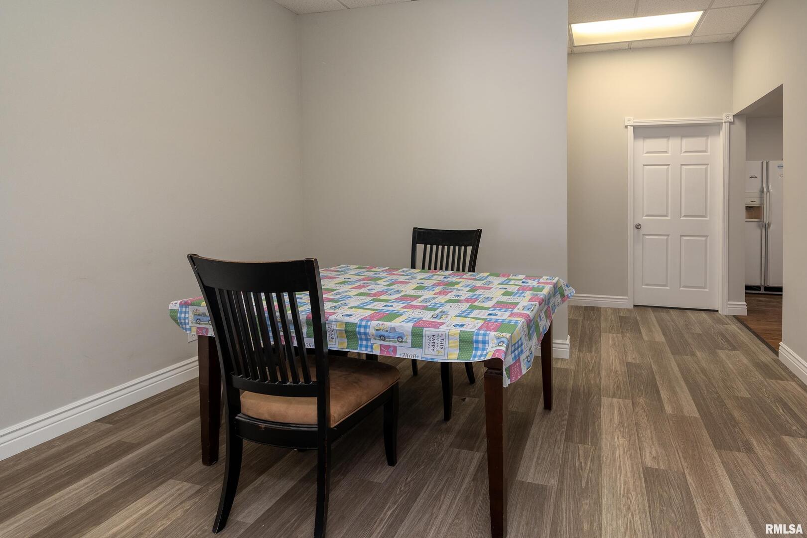 10543 Highway 149 Murphysboro, IL 62966 - Photo 17 of 54 a view of a dining room with furniture and wooden floor