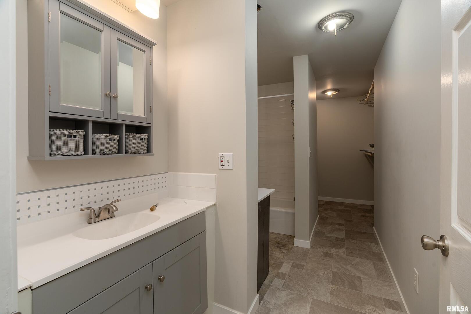 10543 Highway 149 Murphysboro, IL 62966 - Photo 18 of 54 a bathroom with a sink and a mirror