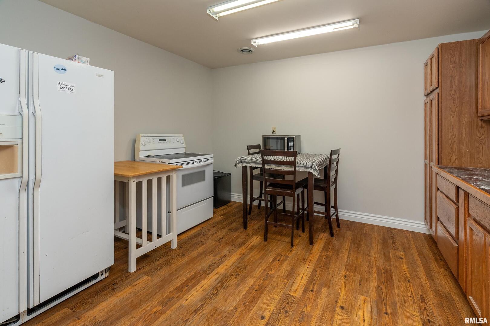 10543 Highway 149 Murphysboro, IL 62966 - Photo 23 of 54 a view of a workspace with furniture and wooden floor