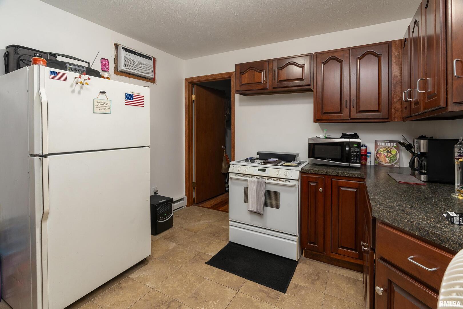 10543 Highway 149 Murphysboro, IL 62966 - Photo 35 of 54 a white refrigerator freezer sitting in a kitchen