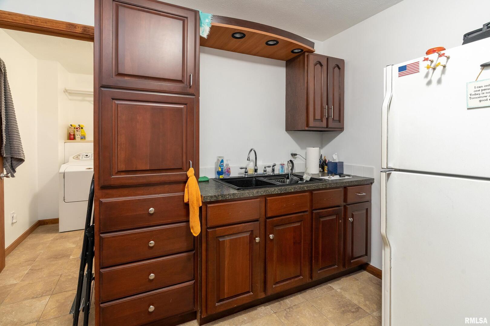 10543 Highway 149 Murphysboro, IL 62966 - Photo 38 of 54 a bathroom with a refrigerator and a sink