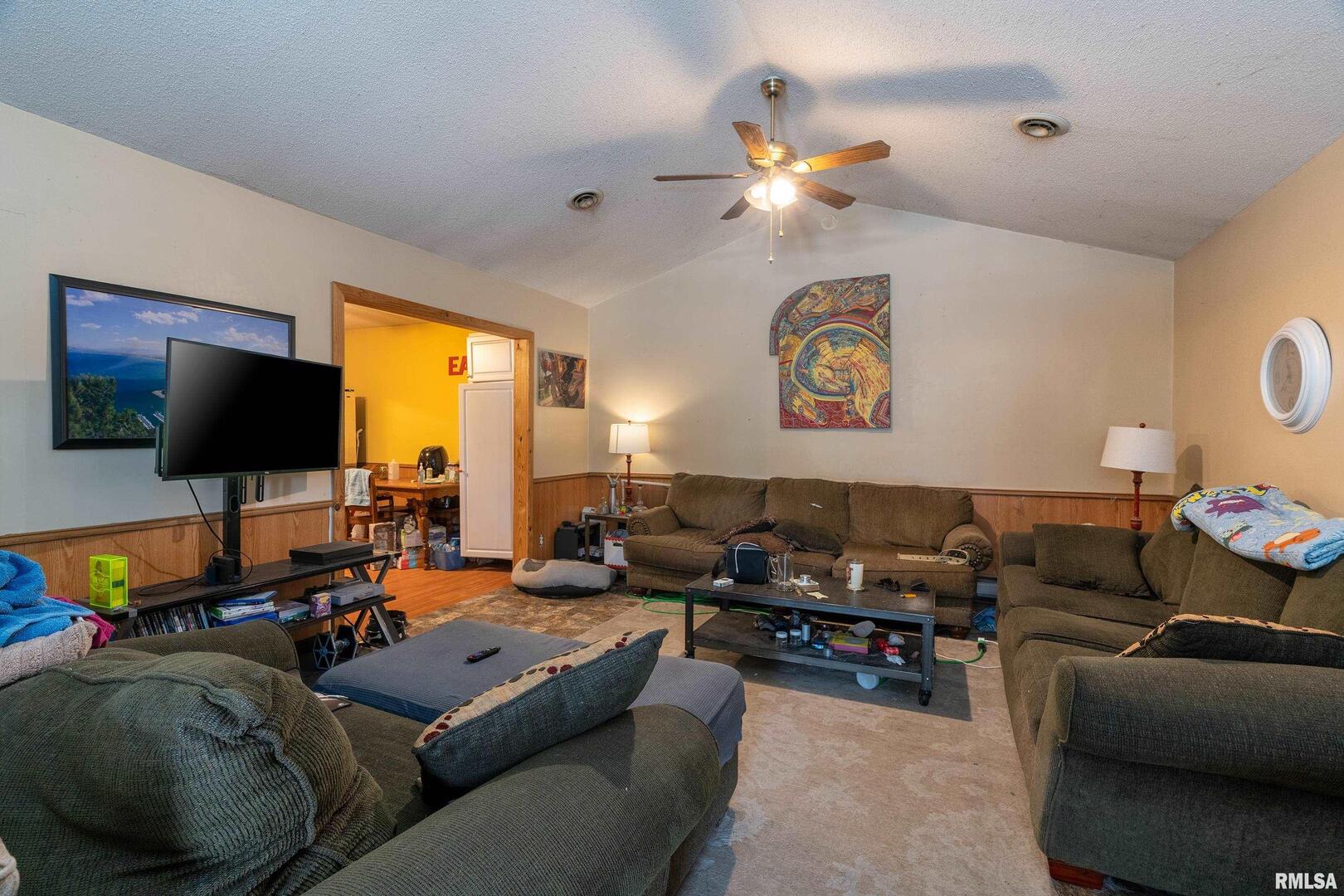 10543 Highway 149 Murphysboro, IL 62966 - Photo 44 of 54 a living room with furniture and a flat screen tv
