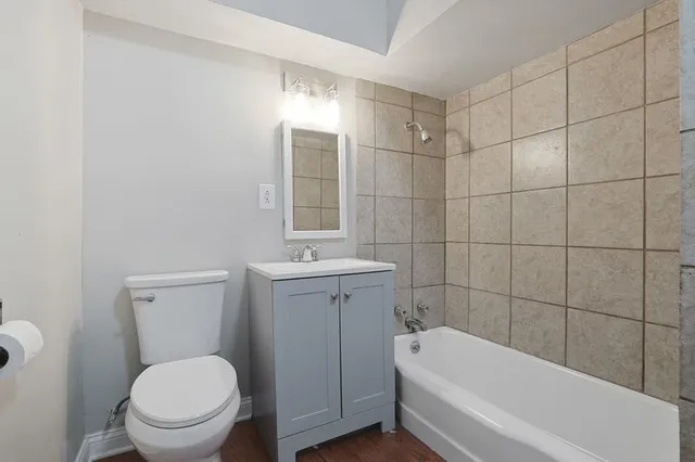 a bathroom with a toilet a sink and bathtub