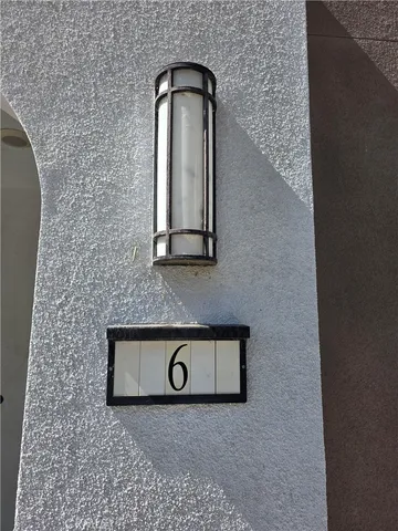 a view of a brick wall with exposed radiator