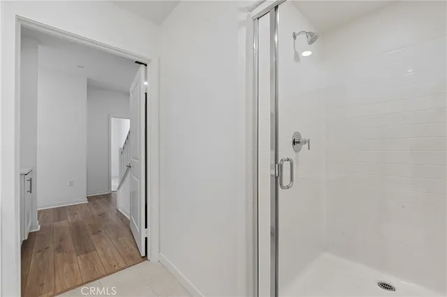 a bathroom with a tub and shower
