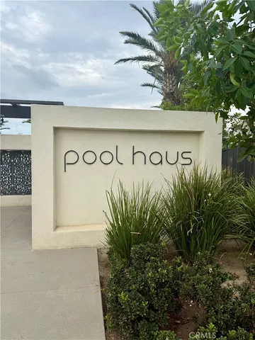 a street sign on a white wall