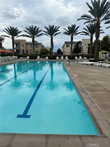 a swimming pool with outdoor seating
