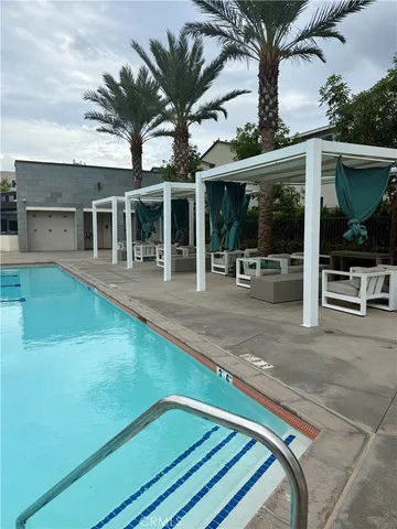 a view of a swimming pool and a yard