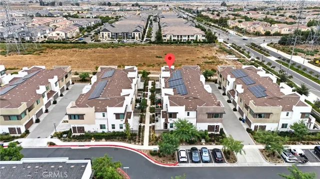 an aerial view of residential building with lake view and ocean view