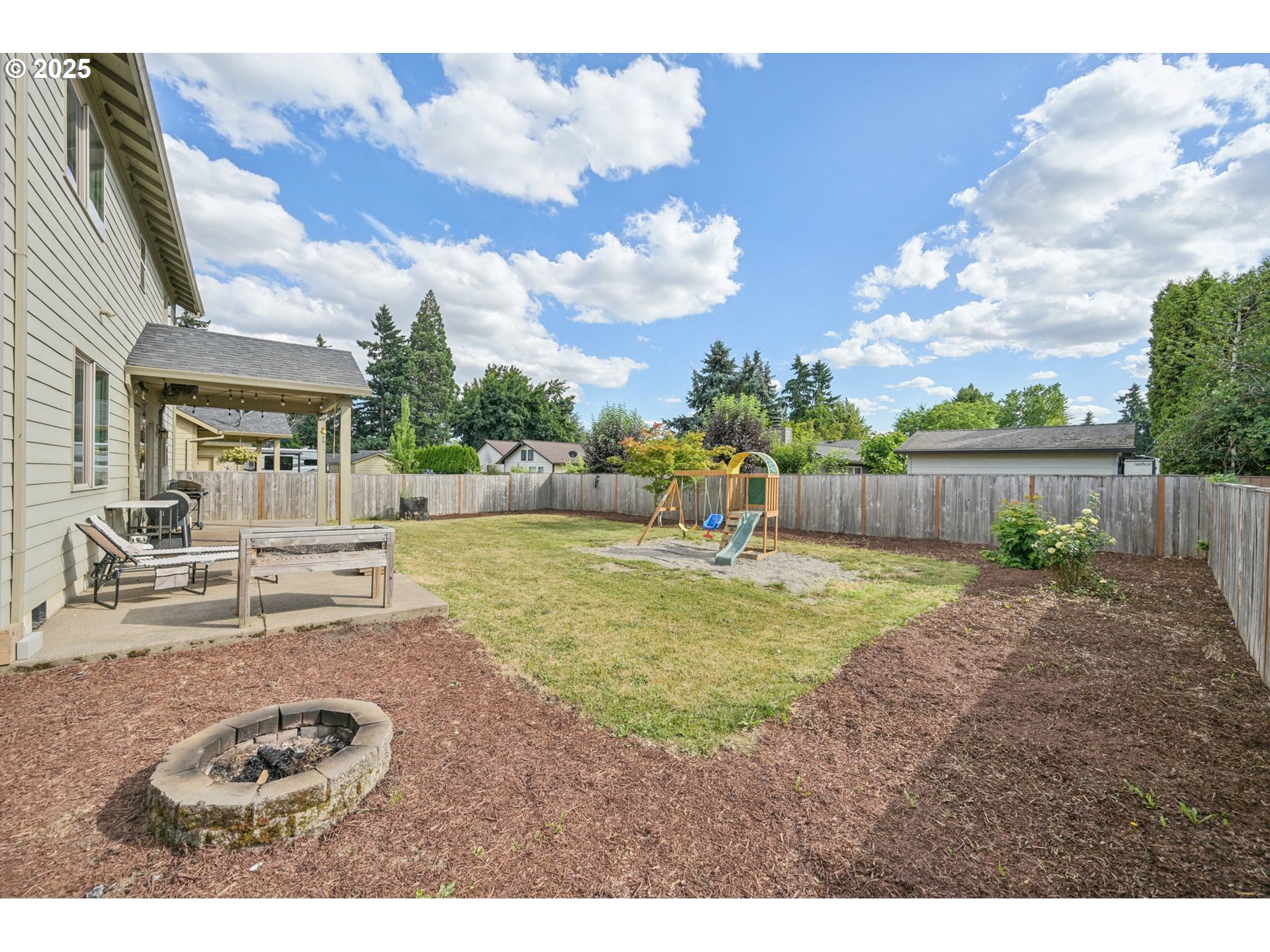 2174 A Street Hubbard, OR 97032 - Photo 29 of 30 a backyard of a house with yard and outdoor seating