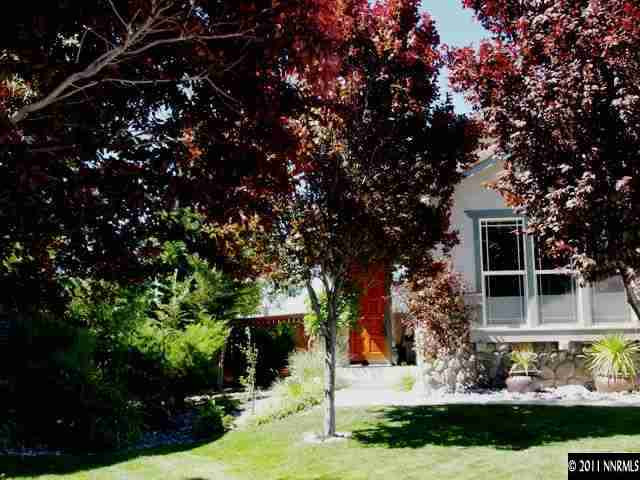 5061 Fall Colors Court Reno, NV 89519 - Photo 1 of 9 a front view of a house with a yard
