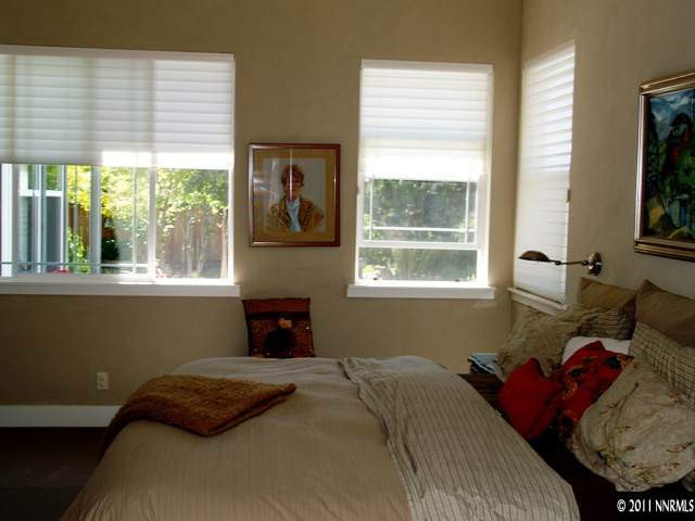 5061 Fall Colors Court Reno, NV 89519 - Photo 5 of 9 a bedroom with a bed and a window