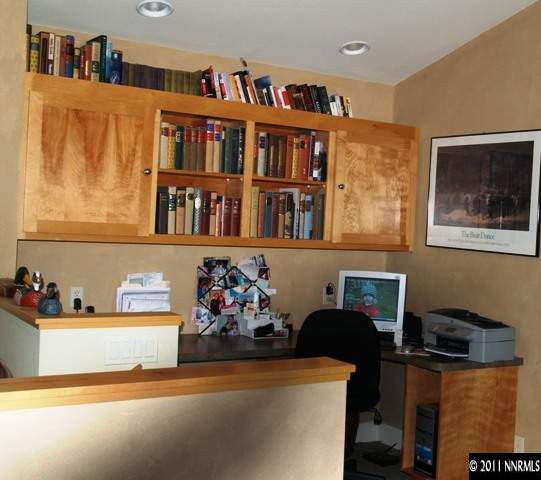 5061 Fall Colors Court Reno, NV 89519 - Photo 7 of 9 a workspace with furniture and book shelf