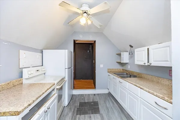 a kitchen with stainless steel appliances granite countertop a stove and a refrigerator