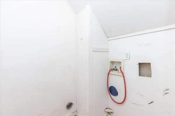 a bathroom with a shower and a window