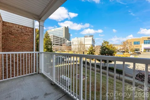 a view of a swimming pool with outdoor seating