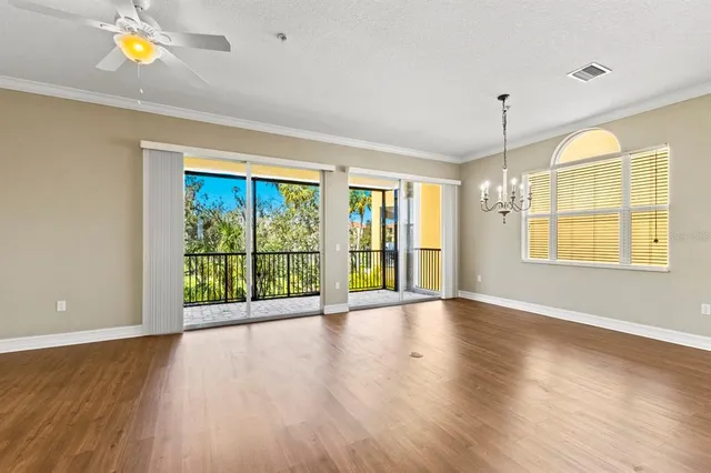 a bathroom with a granite countertop sink toilet and mirror