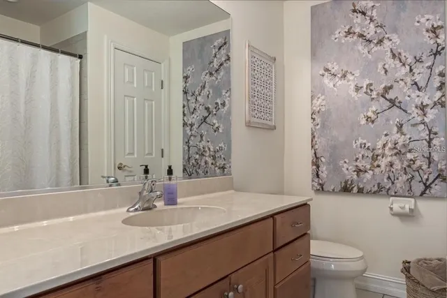 a bedroom with furniture and wooden floor