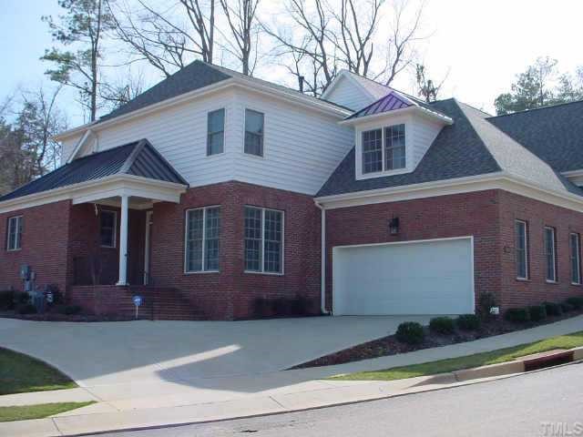 7400 Fontana Ridge Lane Raleigh, NC 27613 - Photo 1 of 1 a front view of a house with a yard and garage