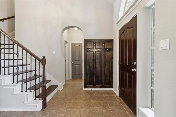 a view of a hallway with entryway door