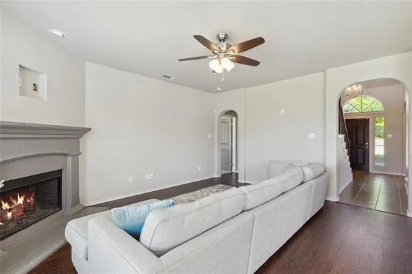 a living room with furniture and a fireplace