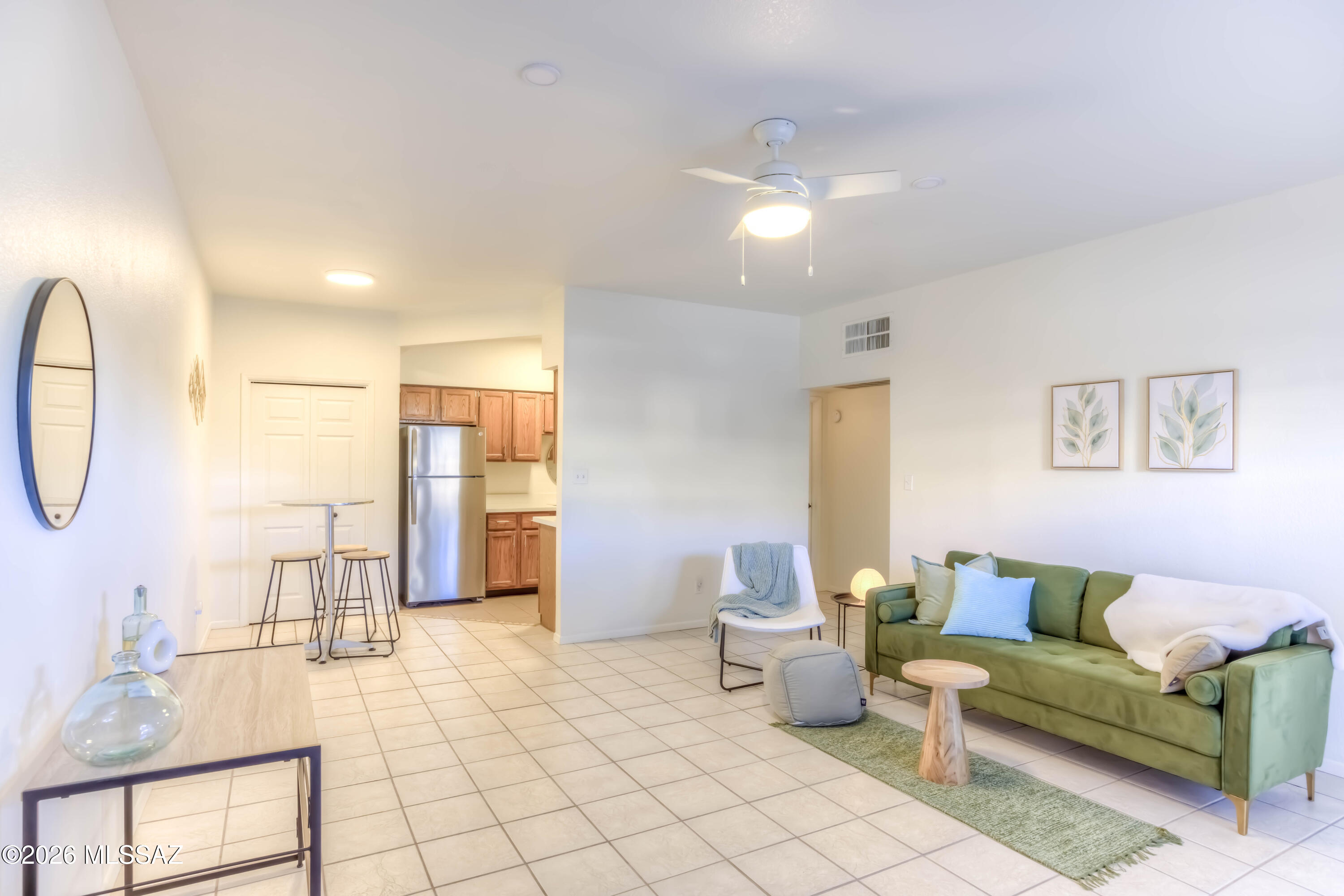 5500 North Valley View Road, Unit 123 Tucson, AZ 85718 - Photo 11 of 36 a living room with furniture and a table