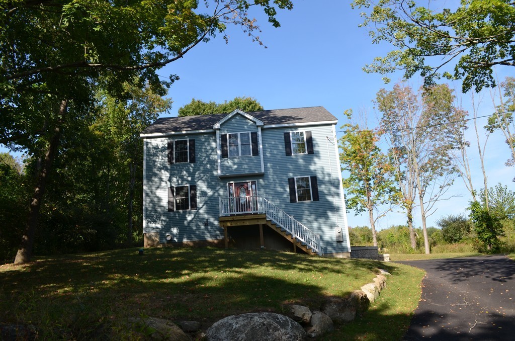 132 Town Farm Road Warren, MA 01083 - Photo 2 of 19 a view of a house with a swimming pool