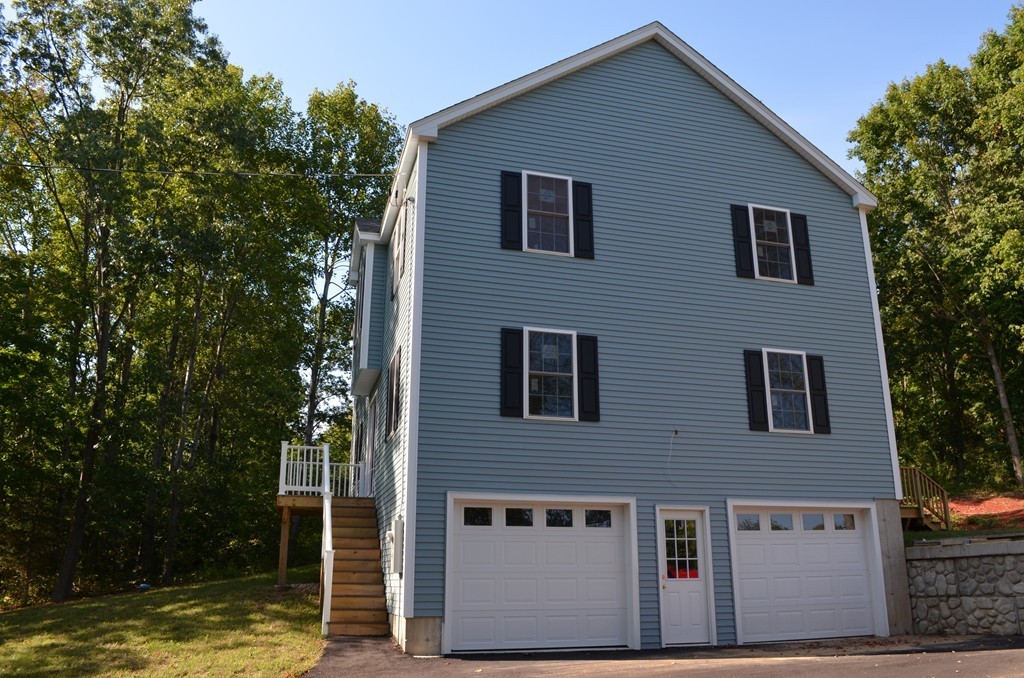 132 Town Farm Road Warren, MA 01083 - Photo 3 of 19 a house that has a large tree in front of it