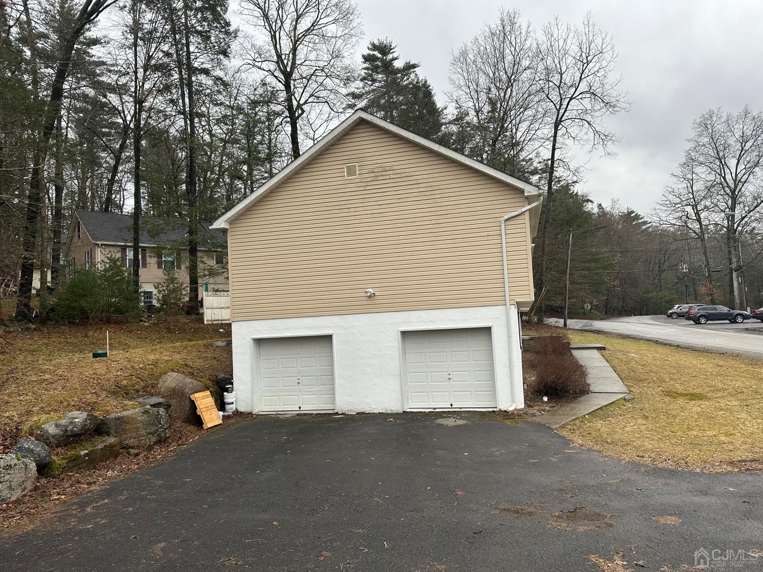 103 Spook Ridge Road Montague, NJ 07827 - Photo 2 of 54 a view of a house with a yard and garage