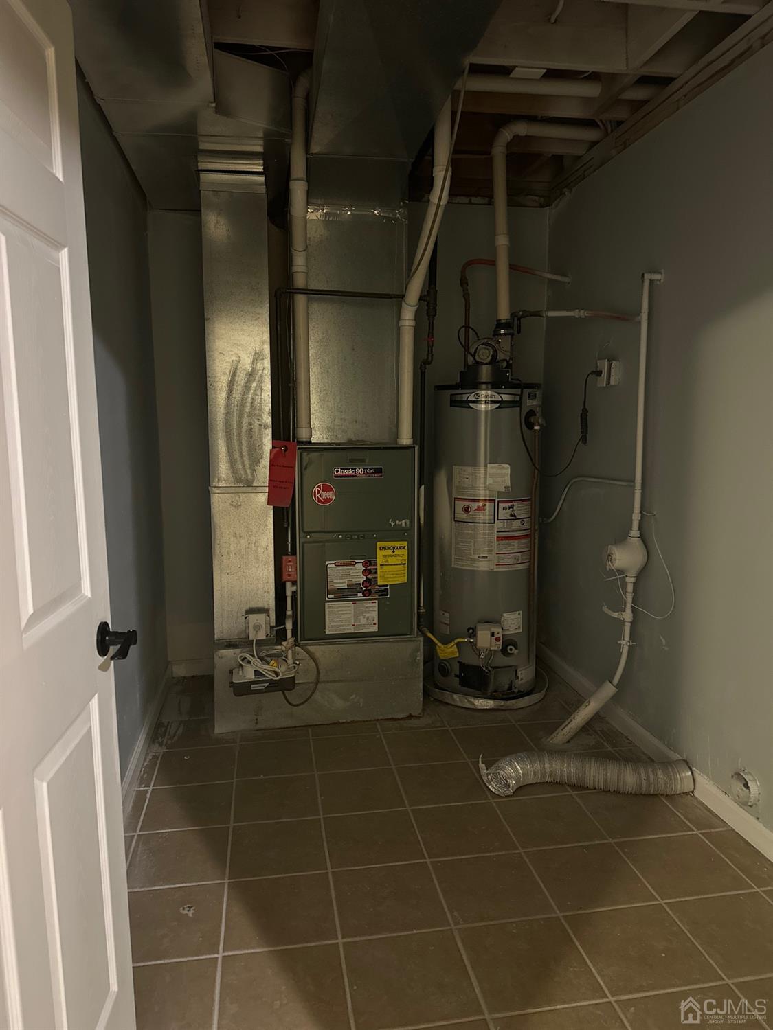 103 Spook Ridge Road Montague, NJ 07827 - Photo 54 of 54 a room with water heater and a glass door