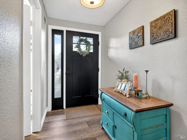 a room with a door and wooden floor