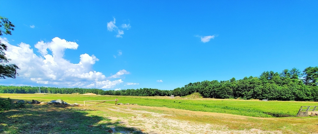 7 Forbes Road Rochester, MA 02770 - Photo 2 of 4 a view of a golf course with a lake