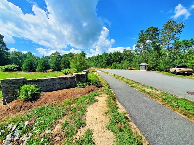 a view of a street with a yard
